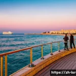 이스라엘에서의 선박 투어 - **Prompt Title: Mediterranean Sunset Serenity in Tel Aviv-Jaffa**
    A wide-angle shot of a cruise ...